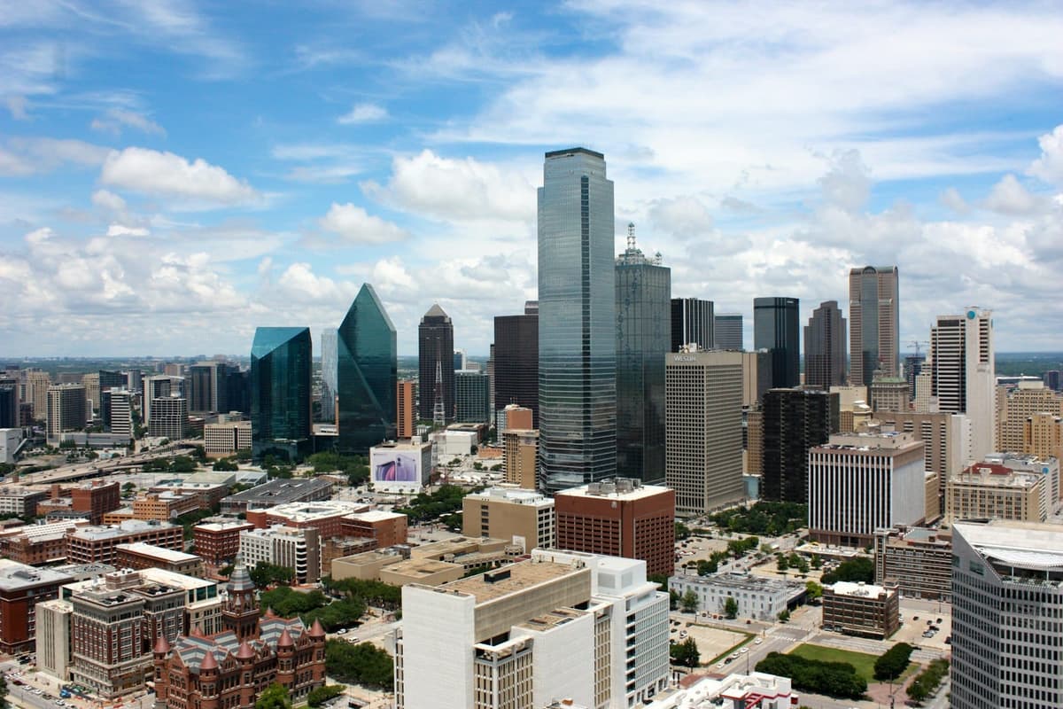 The Dallas skyline under a bright blue sky