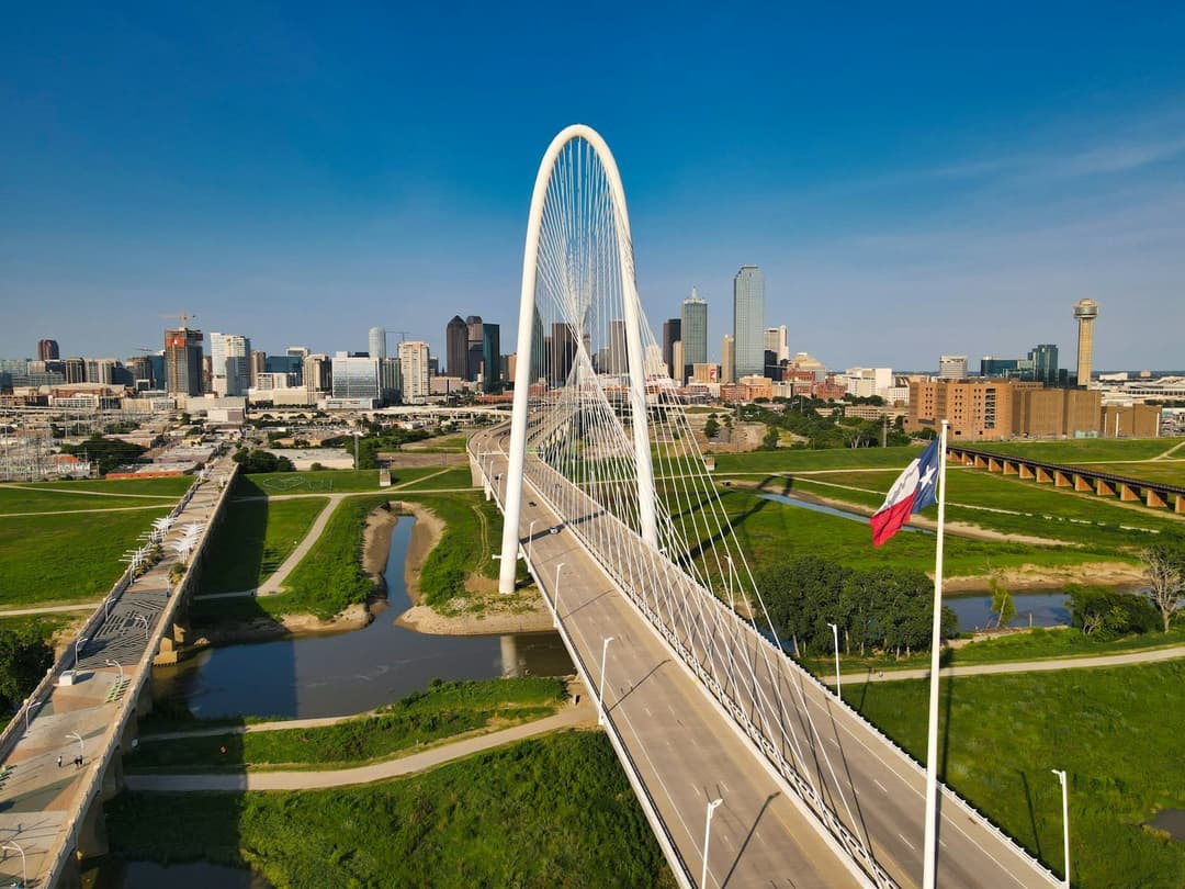 The Margaret Hunt Hill Bridge and Dallas skyline by day